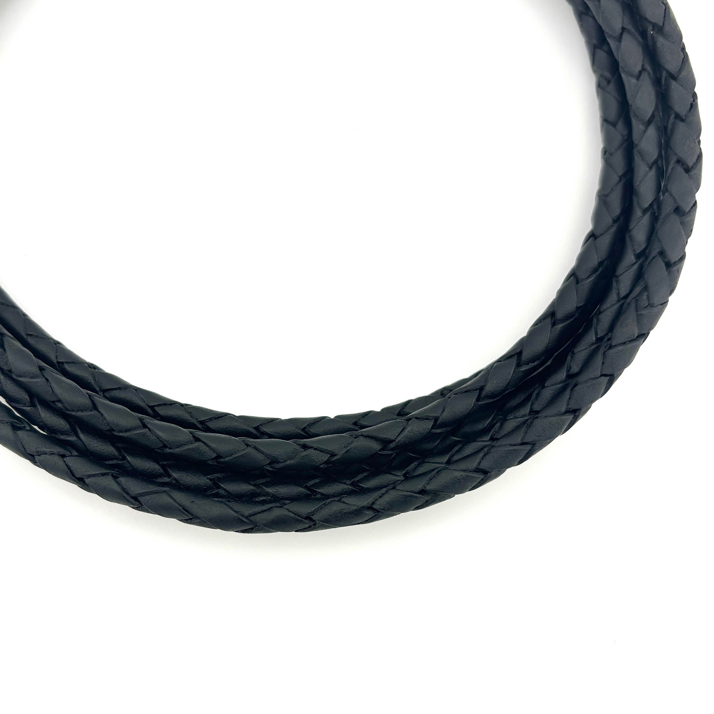 Black braided cord on a white background