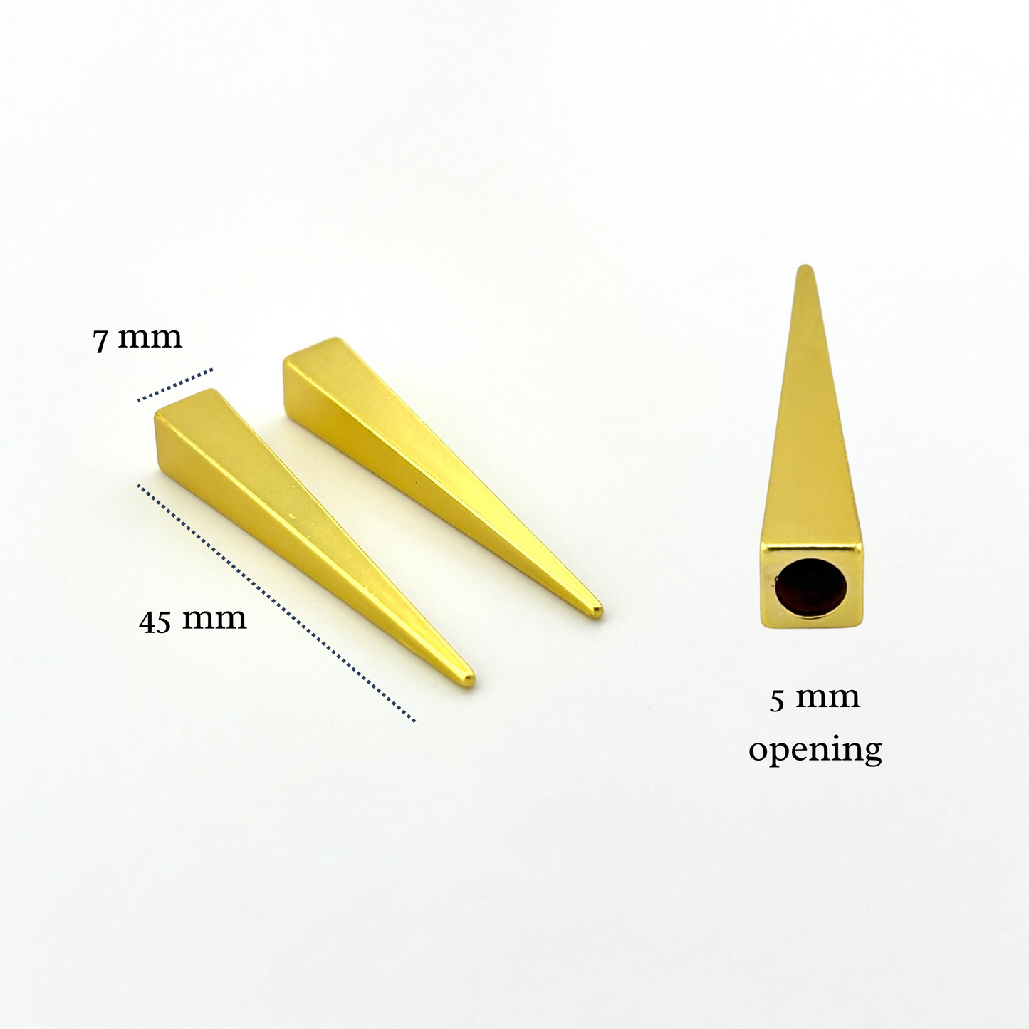 Gold metal cone-shaped objects with measurements on a white background