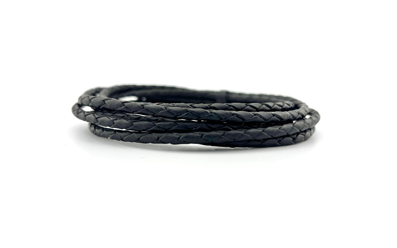 Braided Leather Bolo Cord - 4mm rolled on a white background, showcasing its durability and flexibility.