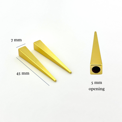 Gold metal cone-shaped objects with measurements on a white background